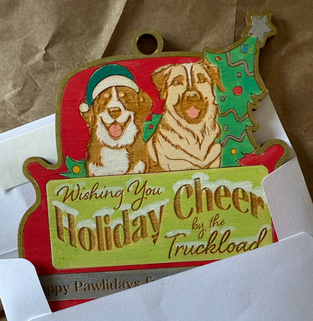 two dogs in the back of a christmas red pickup